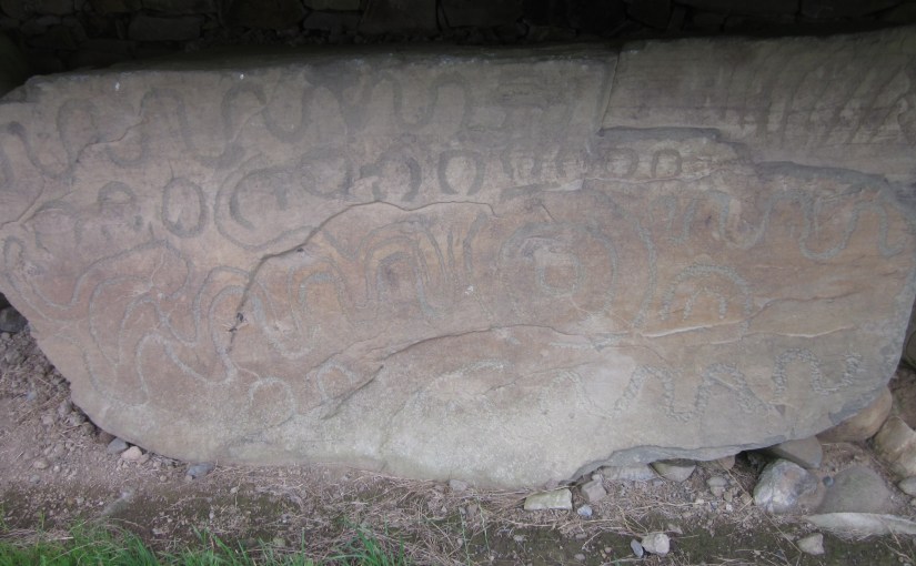 Geometric design art on stone at Knowth tomb Ireland, 2010